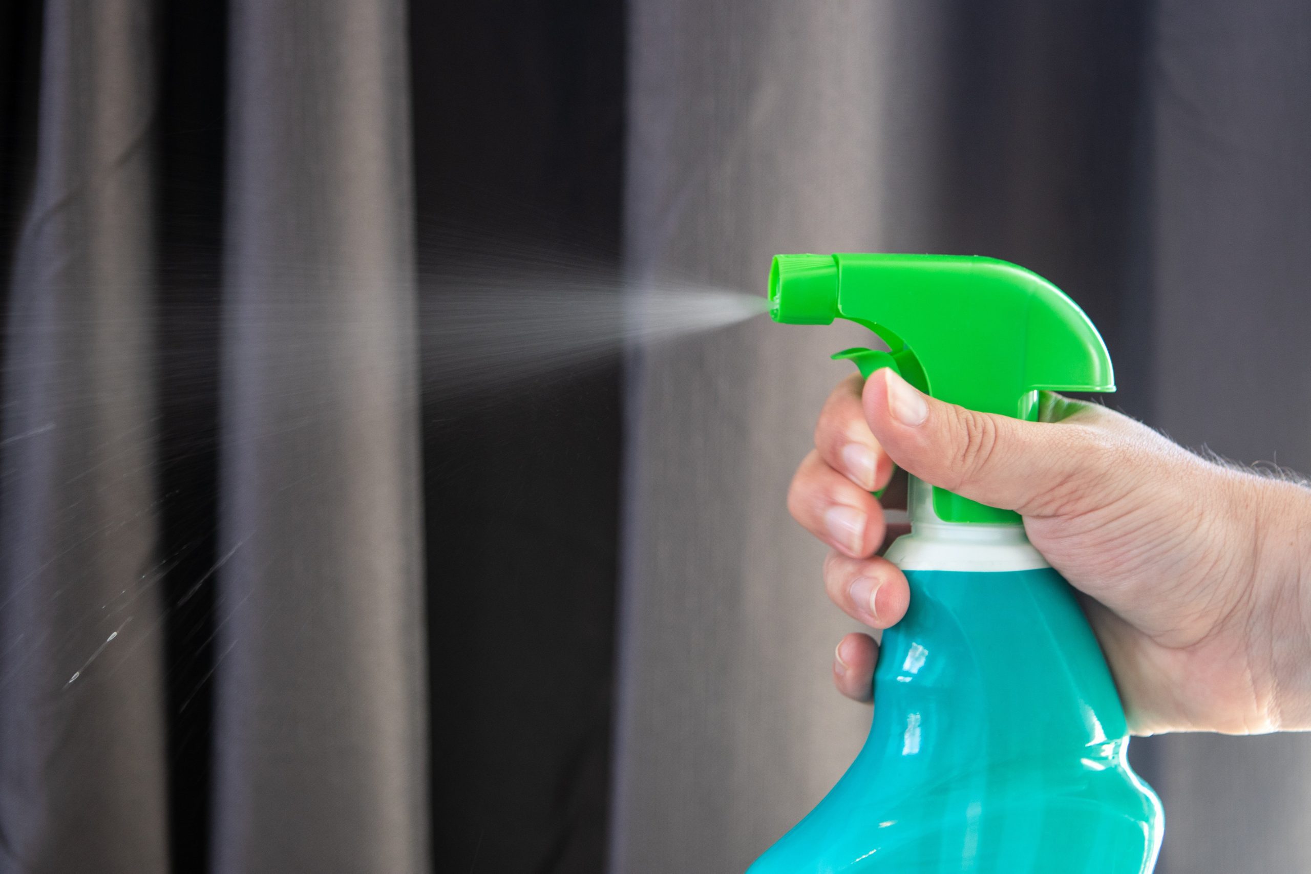 Sell Your Home Safely and Easily During a Pandemic requires extensive cleaning and sanitizing between showings. Pictured here is a spray sanitization bottle being used to clean a house